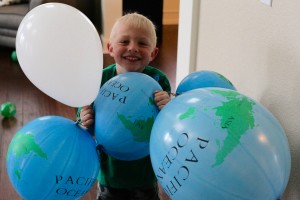 St. Patrick's Day Kids Party punching balloons